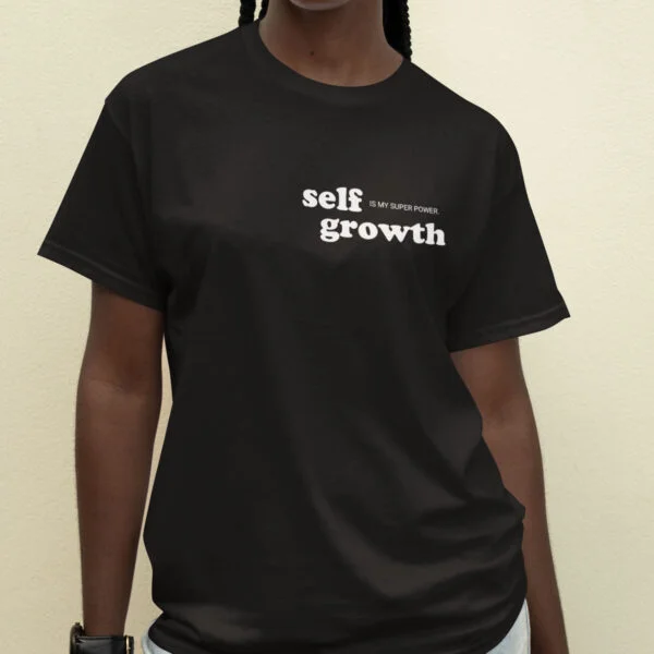 woman wearing a black self growth is my superpower tshirt