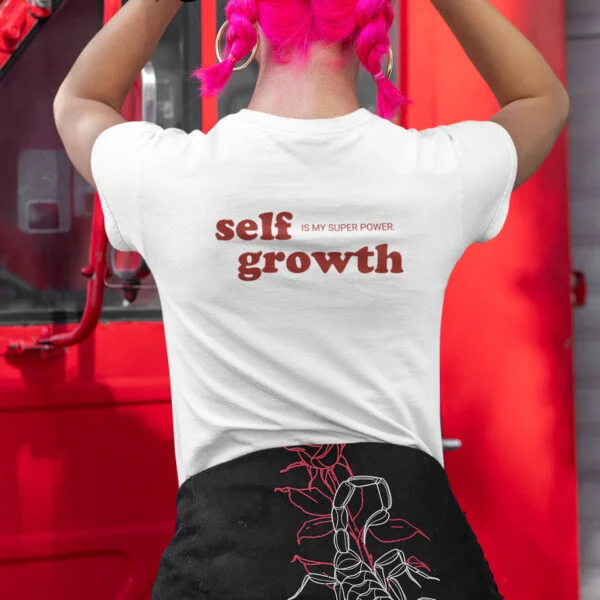 young woman wearing a self growth is my superpower tshirt