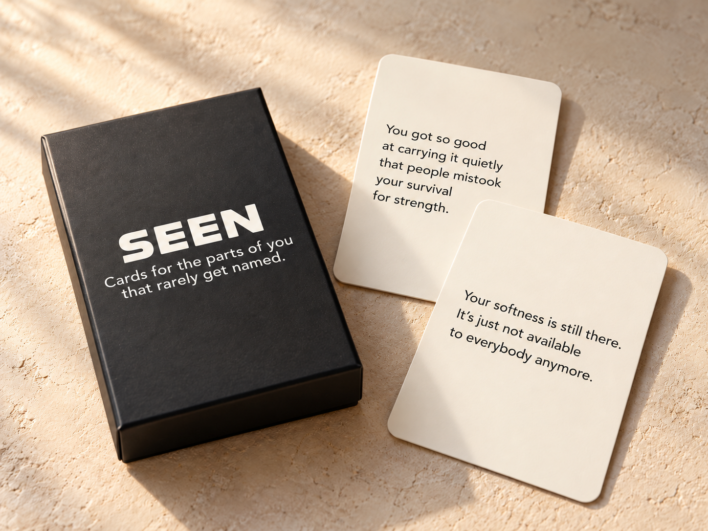 SEEN deck shown with cards about carrying things quietly and protecting your softness.
