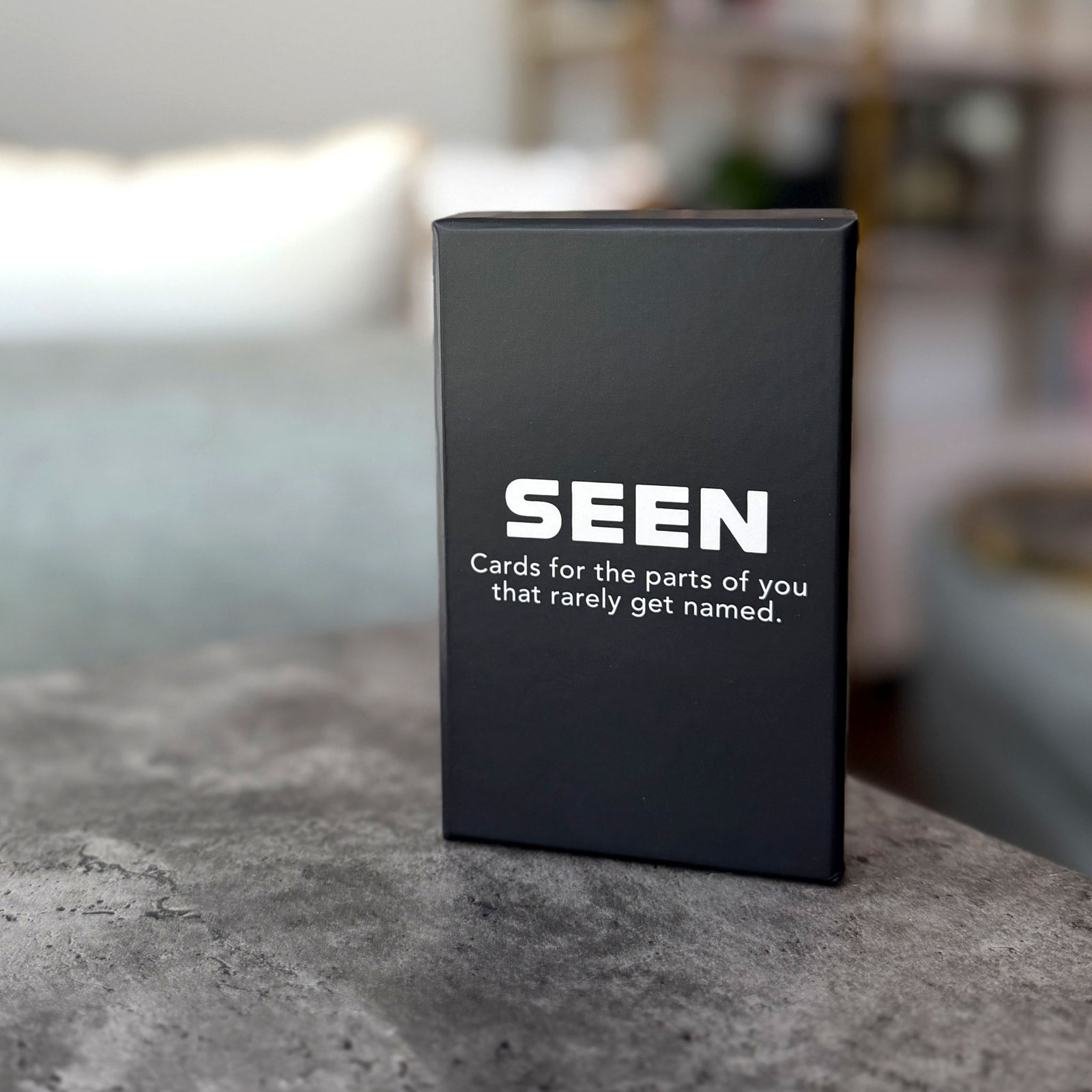 The current SEEN card deck and box.